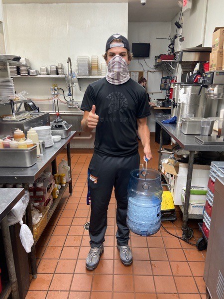 boy with a bucket of ice